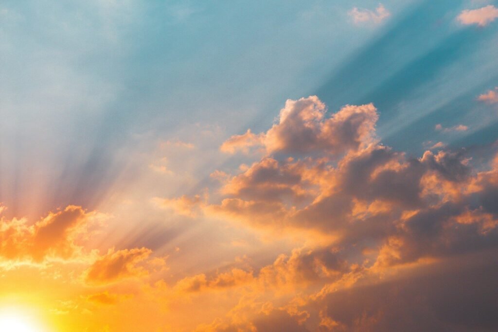 sunset sky with clouds and rays